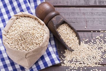 Grains of quinua on wood - Chenopodium quinoa
