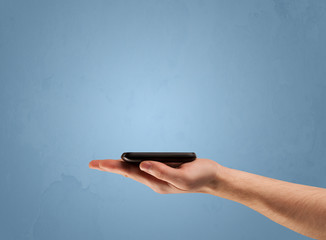 Holding telephone device from profile