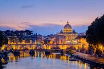 Fototapeta na wymiar Famous citiscape view of St Peters basilica in Rome at sunset