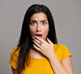 Shocked surprised woman isolated