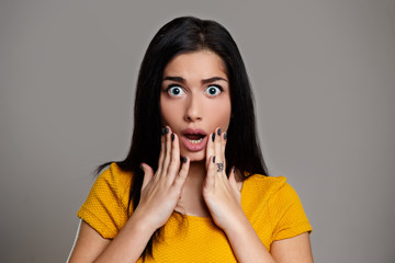 Shocked amazed girl isolated