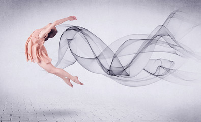 Modern ballet dancer performing with abstract swirl