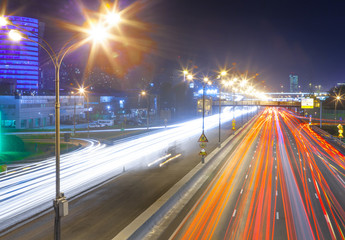 Urban city road with car light trails at night	