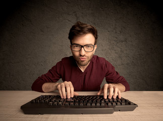 Computer geek typing on keyboard