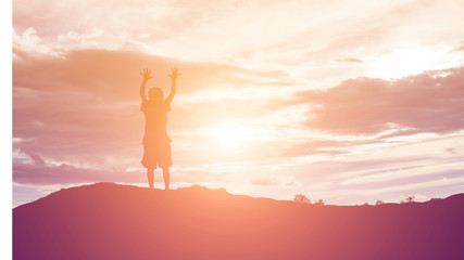 silhouette of a happy children and happy time sunset