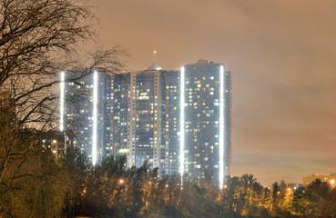 Contemporary residential skyscraper at night.