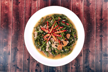 Fried spicy Chinese morning glory with minced pork and dried shrimps .