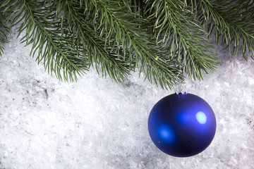 Christmas ball and spruce branch
