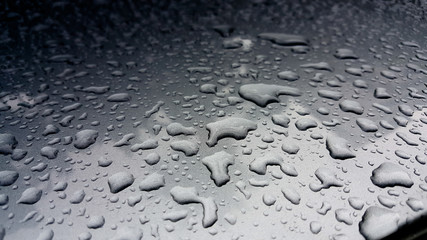 Close-up of water droplets on metal surface as background
