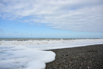 Waves on the pebble beach of the sea during a storm