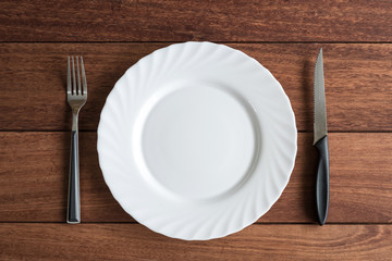 Empty plate with knife and fork, Top view
