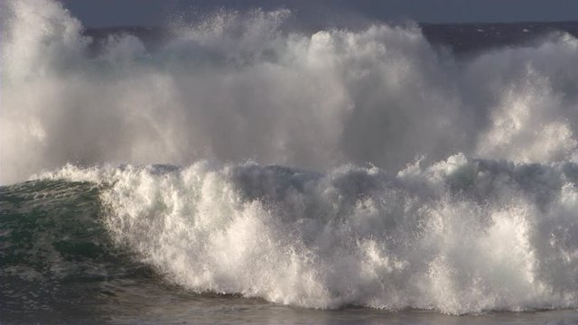Rough ocean waves breaking in slow motion
