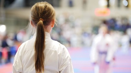 Young karate girl in karate competitions © KONSTANTIN SHISHKIN
