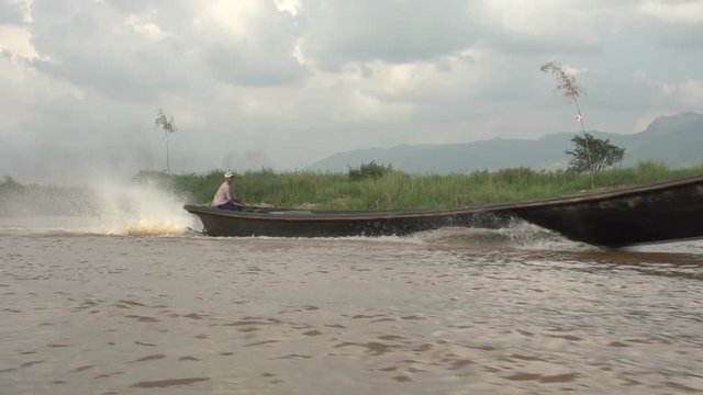 Inle lake, boat passes at high speed