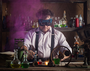 crazy medieval scientist working in his laboratory