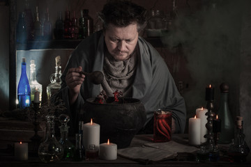 wizard brews a potion