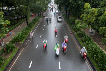 HO CHI MINH, VIETNAM - MAY 13 2017: Undefined motorcycle traffic in rain. Is located in the South of Vietnam, is the country's largest city