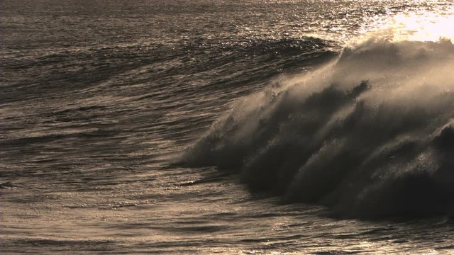 Beauty shot of ocean waves at dusk in slow motion
