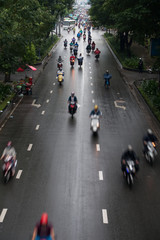 HO CHI MINH, VIETNAM - MAY 11 2017: Motorcycle traffic in rain. Is located in the South of Vietnam, is the country's largest city, population 8 million