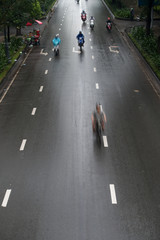HO CHI MINH, VIETNAM - MAY 11 2017: Motorcycle traffic in rain. Is located in the South of Vietnam, is the country's largest city, population 8 million