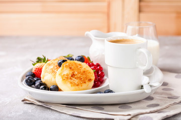 Cottage cheese pancakes with berries. Selective focus. Russian cheesecakes. Copy space