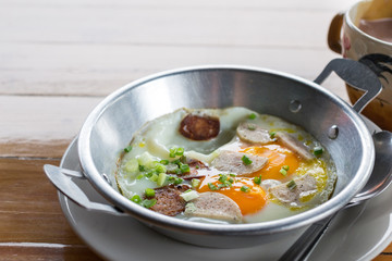 Fried eggs in a frying pan with sausage with pork mixed black pepper ,Breakfast, Healthy food.