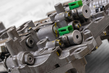 Fototapeta premium Mechanical part with metal components and hydraulic valves