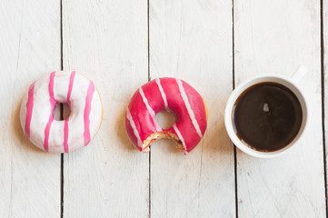 Delicious donuts with coffee for breakfast