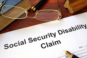 Social security disability claim on a wooden table.