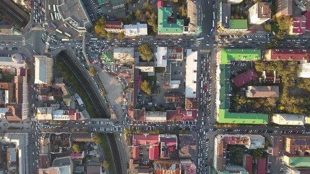 Vladivostok Russia downtown Day city traffic jam cars. Summer spring day. Aerial drone flight above. Old central famous streets. Colorful roofs. 