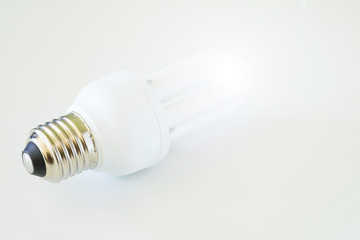 White light bulb on white background