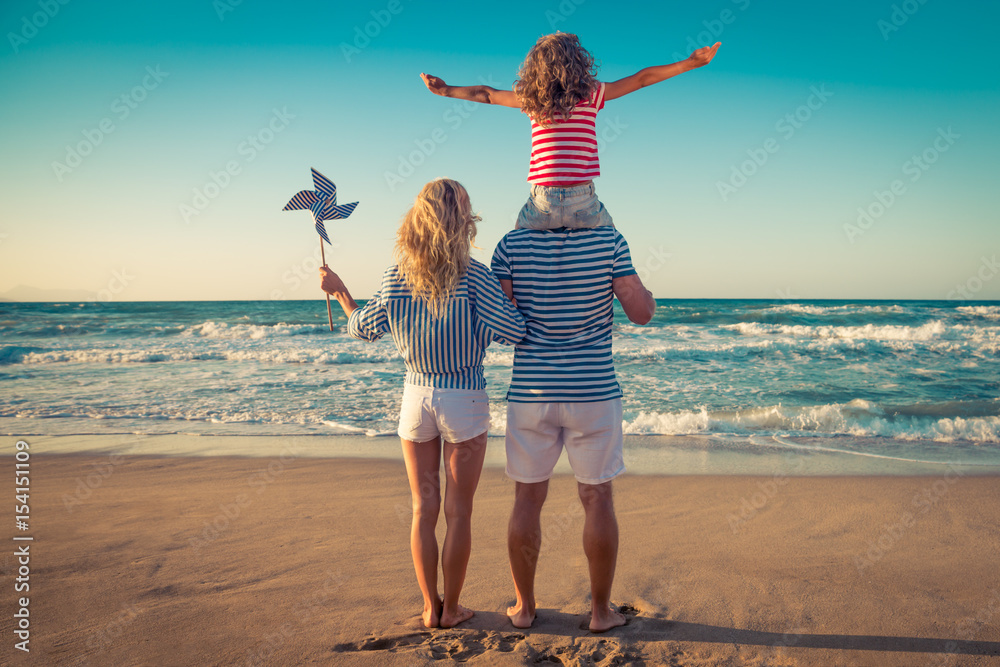 Wall mural Happy family having fun on summer vacation