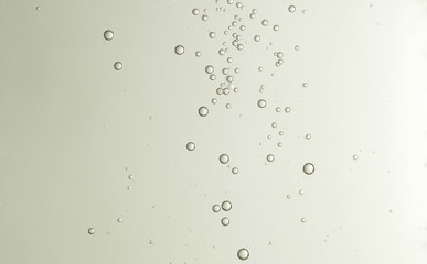 Some nice cold champagne bubbles soars over a blurred background
