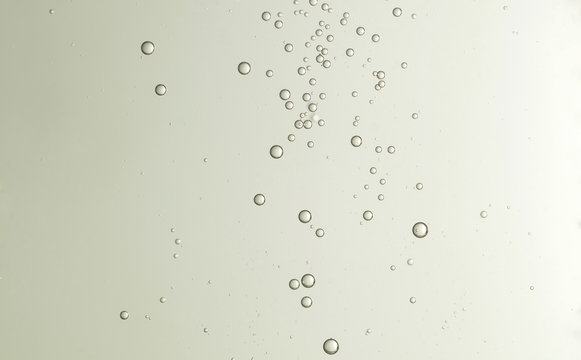 Some nice cold champagne bubbles soars over a blurred background