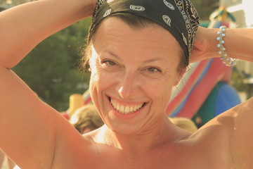 Caucasian brunette woman on beach in vacation