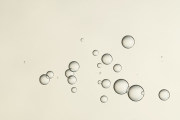 A group of air bubbles over a light background
