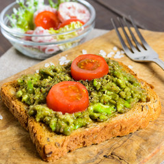 Avocado toast with whole wheat bread and vegetable salad