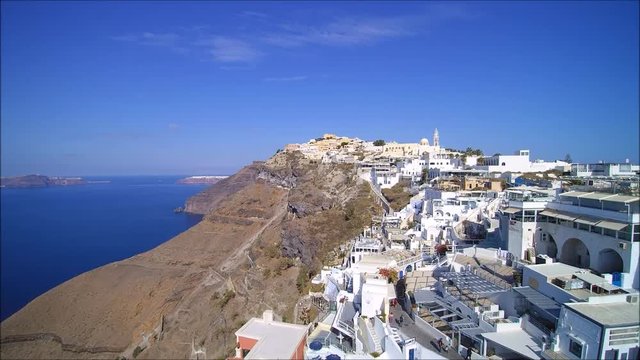 Drone flight over the village of Fira and the caldera, on the Island of Santorini, Cyclades, Greece