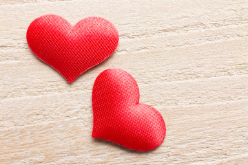 Heart-shaped objects on a wooden background