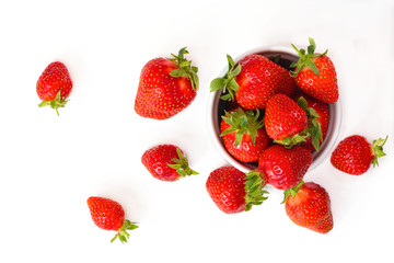 Organic fresh strawberries fruit in white cup isolate on white background