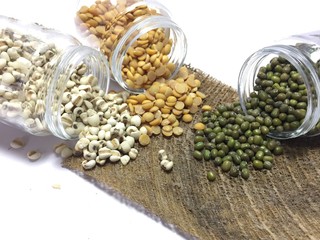 Tree seed bean spread from bottle isolated