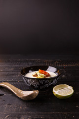 Japanese soup with shrimps on the wooden table. Copy space