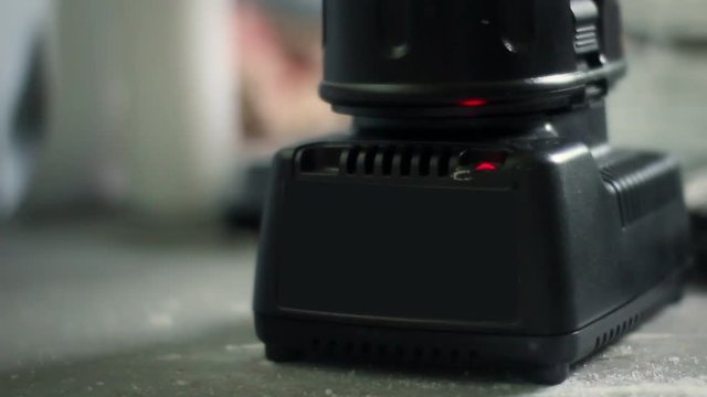 Generic power tools battery charging near construction zone 