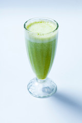green vegetable smoothie on white backgroun. Celery smoothies