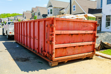garbage containers near the new home, Red containers, recycling and waste construction site on the background