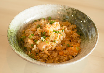 garlic rice with smoked salmon on wood table