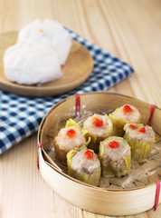 china dumpling with pork bun background on wood table