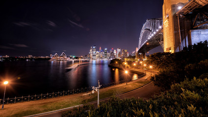 Fototapeta premium Sydney nightlight, Australia. May 17, 2017. Sydney city night with harbour bridge and opera house landmarks building. The view from milsons point.