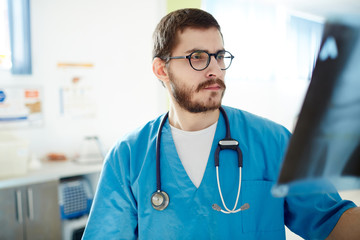 Radiologist looking at x-ray image