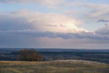 Cloudy landscape over the autumn valley